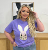 A purple t-shirt with a cartoon bunny face on the front.