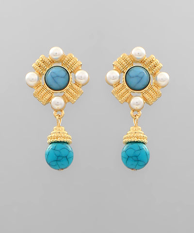 A pair of gold and turquoise earrings with pearl detailing.