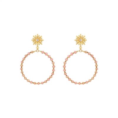 A pair of dangling earrings which feature a hollow circle shape and has gold and peach detailing. 