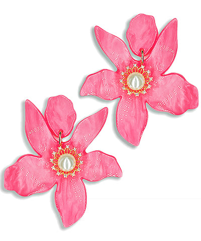 A pair of dangling hot pink earrings in the shape of a flower.