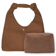A brown suede shoulder bag with knot detailing on the straps and a small toiletry bag included.
