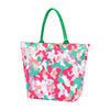 A large beach tote in a pink and green camo fabric and green strap.