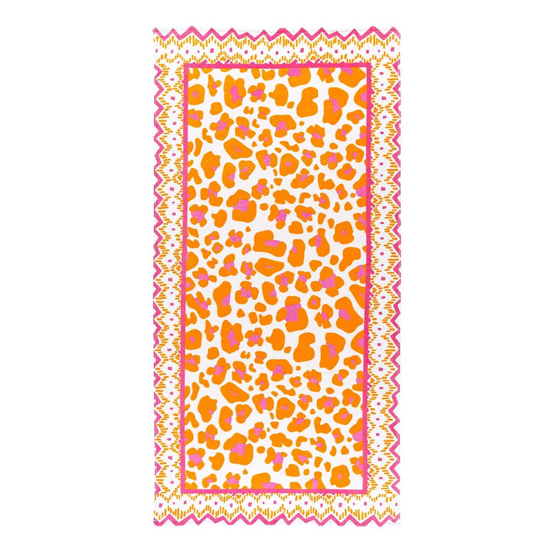 A large beach towel with hot pink and orange animal print along with an aztec print around the edges.
