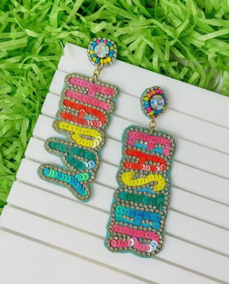 A pair of dangling earrings with sequins spelling "happy" on one and "easter" on the other featuring various colors.