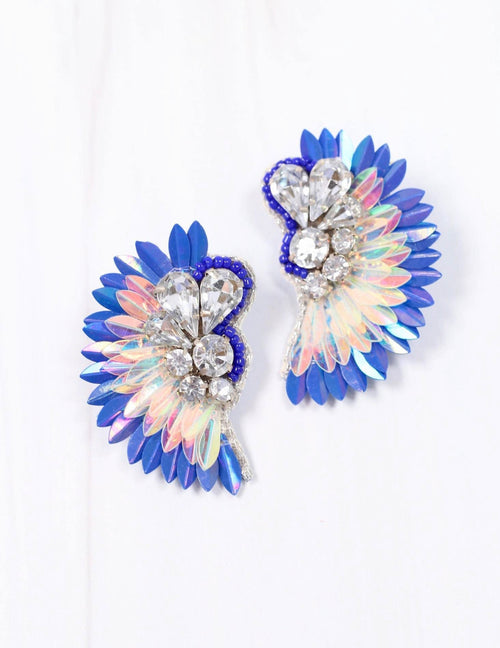 A pair of holographic earrings that feature different types of embellishments and jewels in a wing shape.