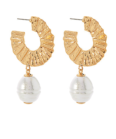 A pair of textured gold hoops with a dangling pearl pendant.
