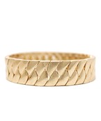 A gold textured wide bracelet.