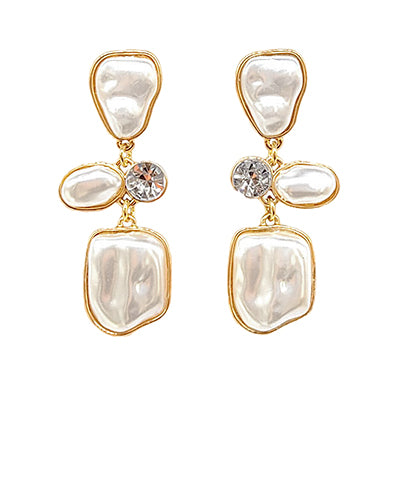 A pair of dangling earrings with chunky pears and gold outlining. 