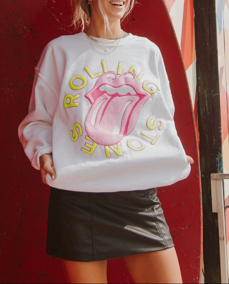 A white crewneck sweatshirt with the Rolling Stones logo in pink and yellow. 