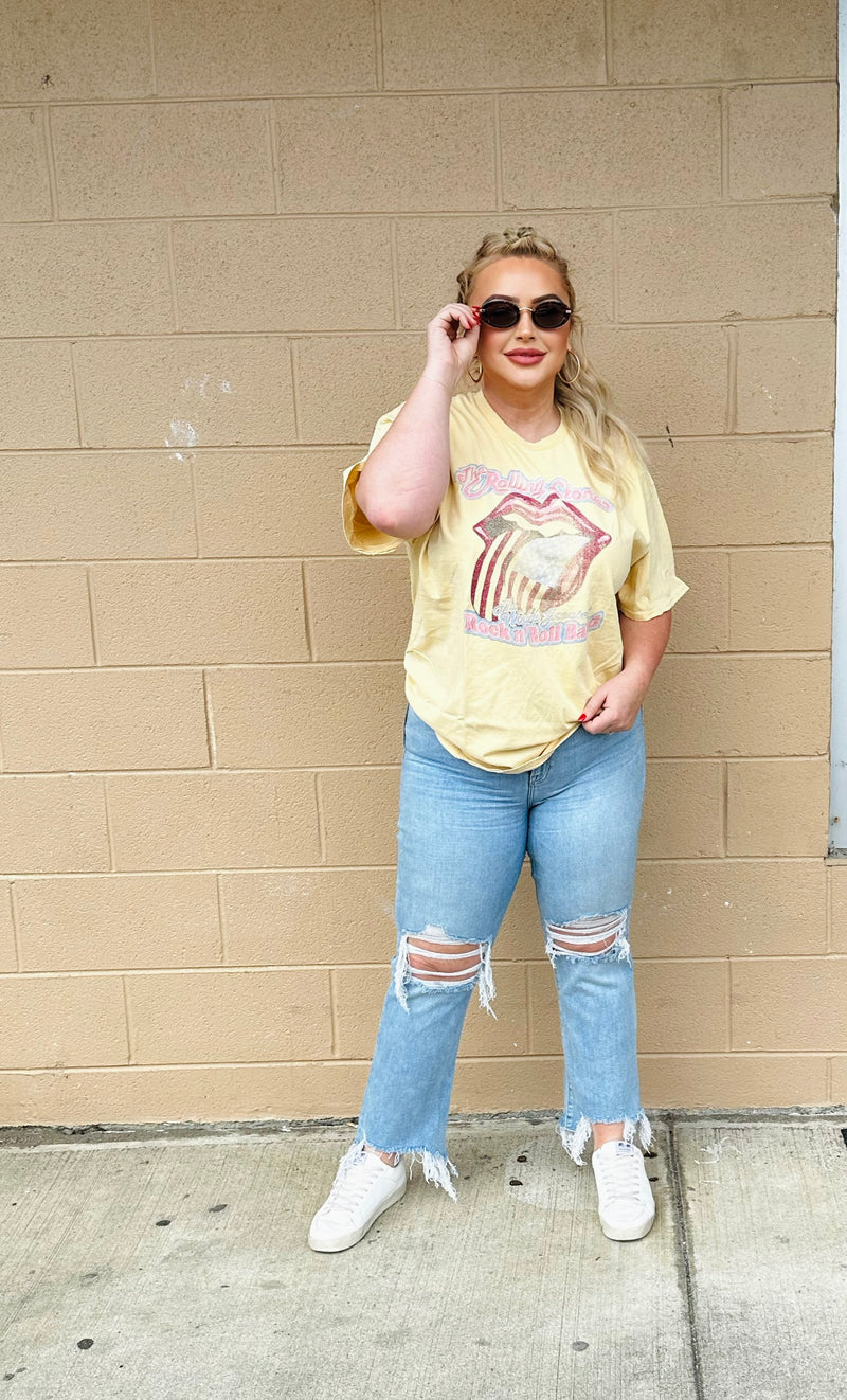 A light yellow graphic t-shirt with a washed out Rolling Stones graphic.