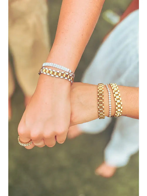 A gold and diamond tennis bracelet. 
