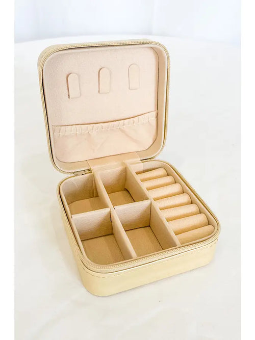 A light yellow travel jewelry case.