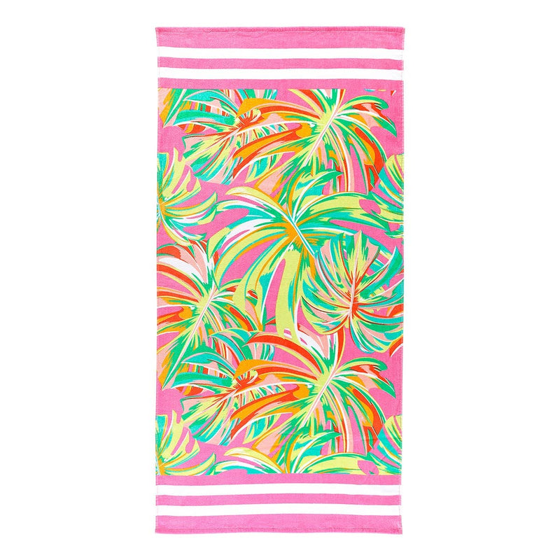 A multicolored beach towel with a leaf print and stripe detailing on the ends. 