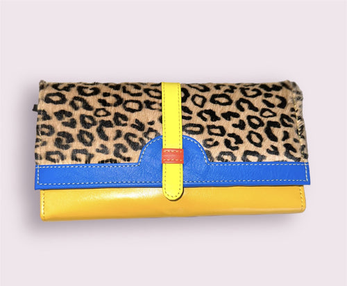 A yellow, blue, and cheetah print wallet clutch.