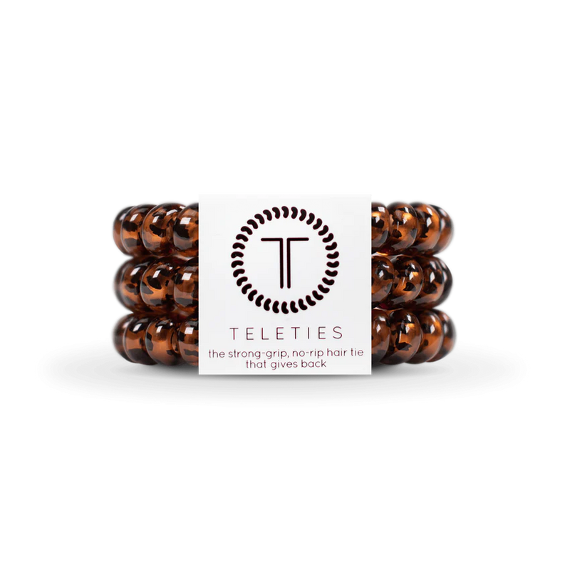 A pack of 3 springy, no-pull, rubber hair ties in the color tortoise.