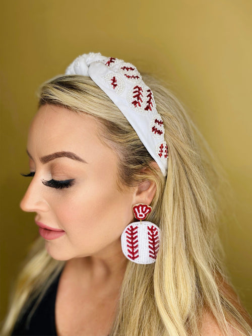 Large beaded earrings in the print of a baseball.