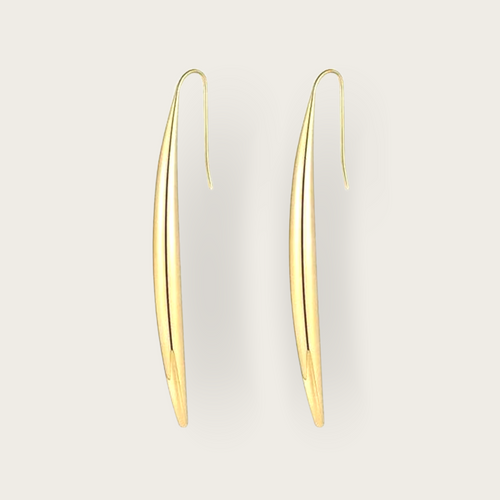 A pair of long, slender gold earrings. 