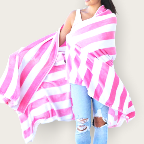 A hot pink and white striped large beach towel.