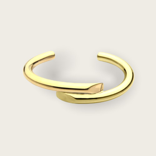 A gold overlapping cuff bracelet.