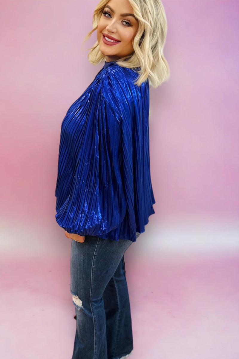 A royal blue metallic pleated long sleeve blouse with flare sleeves and a high neck.
