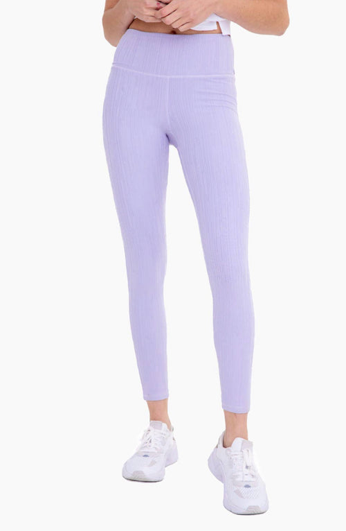 A pair of light purple textured leggings featuring a high waist.