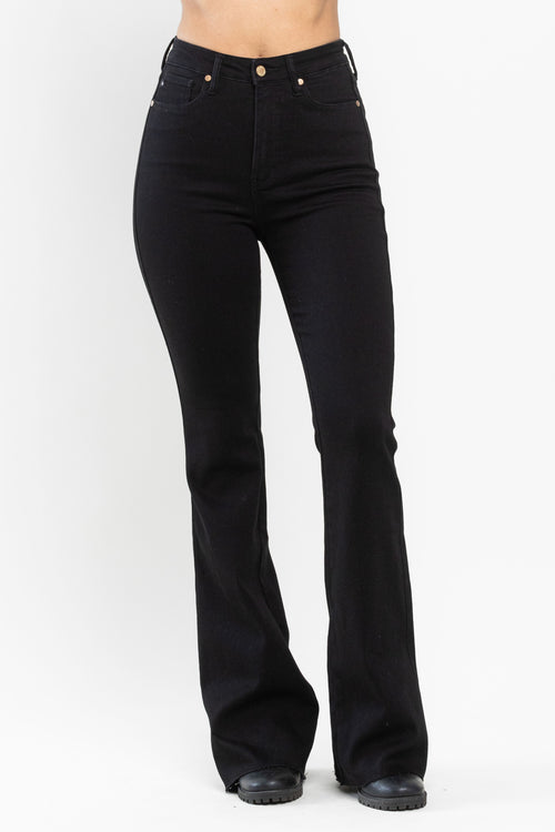 A pair of black jeans with a high waist and flare leg. 
