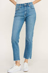 A pair of high-rise straight jeans in a medium denim wash that are slightly cropped with a frayed hem.
