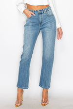 A pair of high-rise straight jeans in a medium denim wash that are slightly cropped.