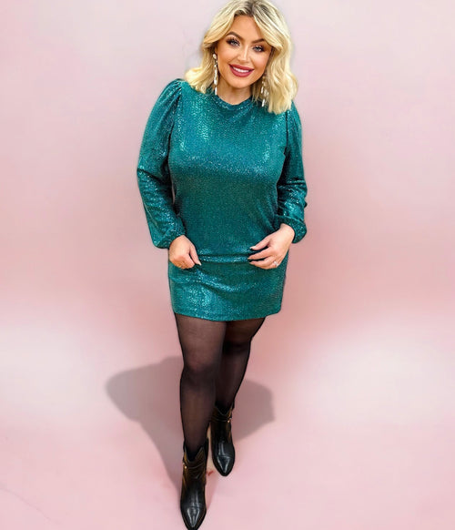 An emerald green long sleeve mini dress with puff sleeves and shimmer fabric. 