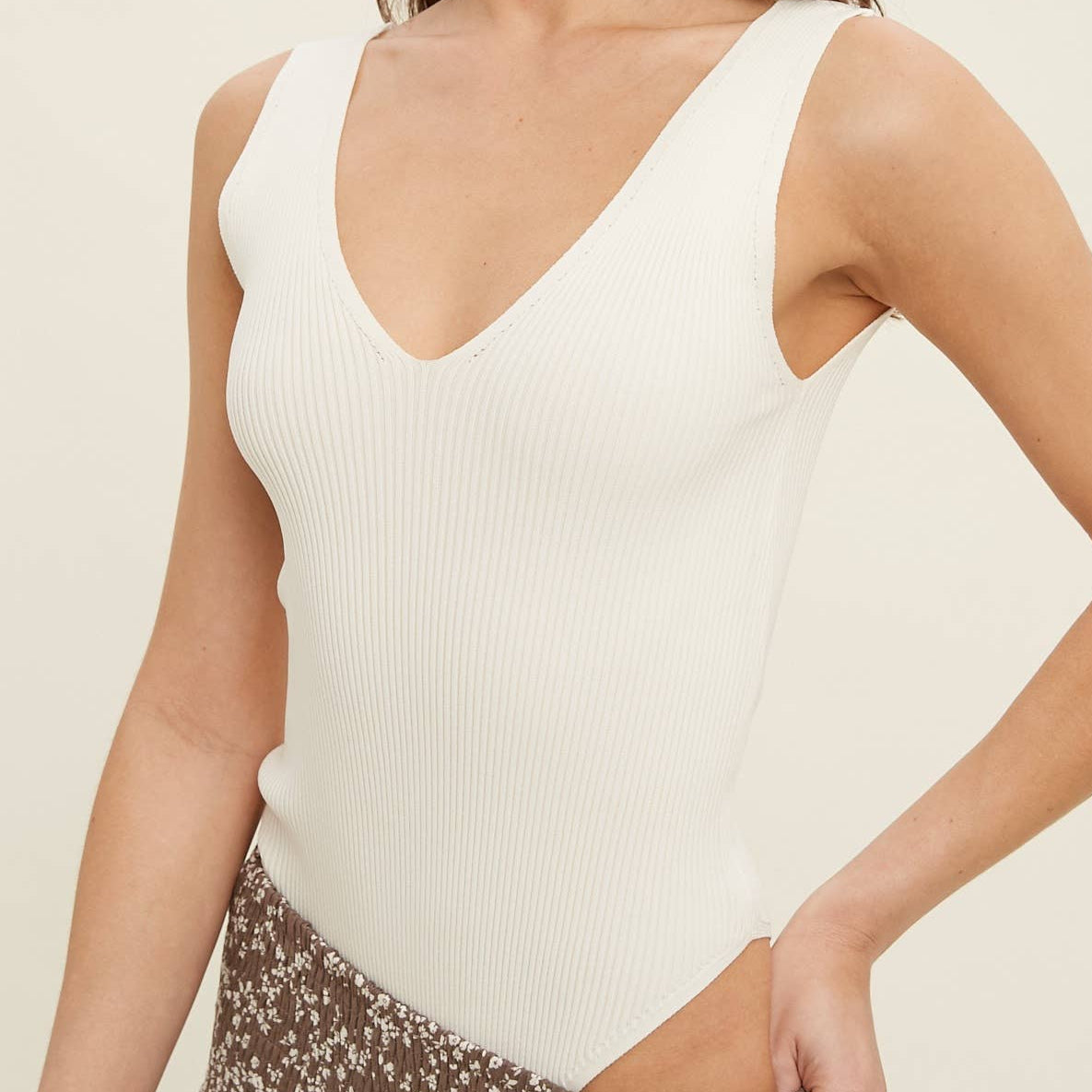 RIBBED KNIT SLEEVELESS BODYSUIT