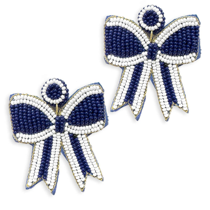 A pair of navy and white beaded earrings in the shape of bows. 