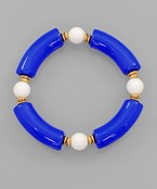 A royal blue and white beaded bracelet.