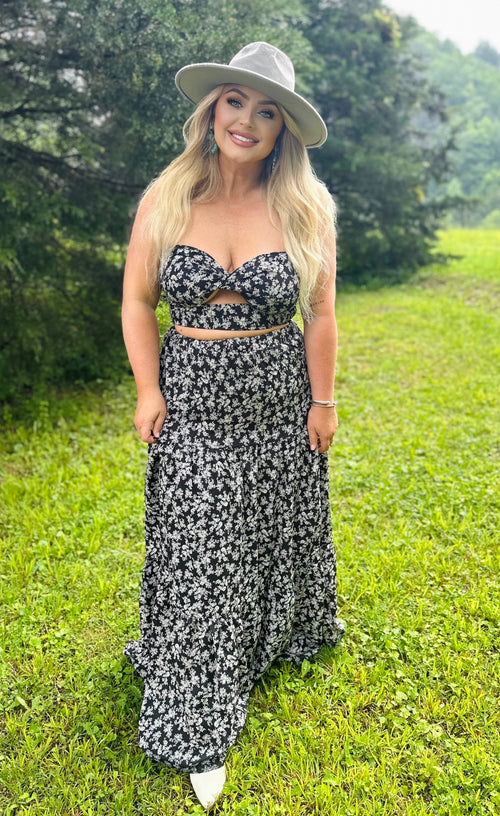 A tube top and maxi skirt set with a black and white floral fabric and key hole on the top.