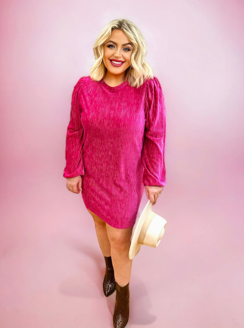 A hot pink textured mini dress featuring loose long sleeves and a high scoop neck.