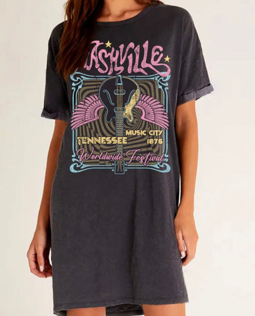 A black washed t-shirt dress with "Nashville" written in pink and a nashville graphic below. 