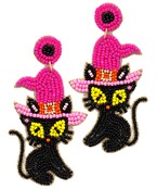 A large pair of beaded earrings in the shape of a black cat with a pink witch hat.