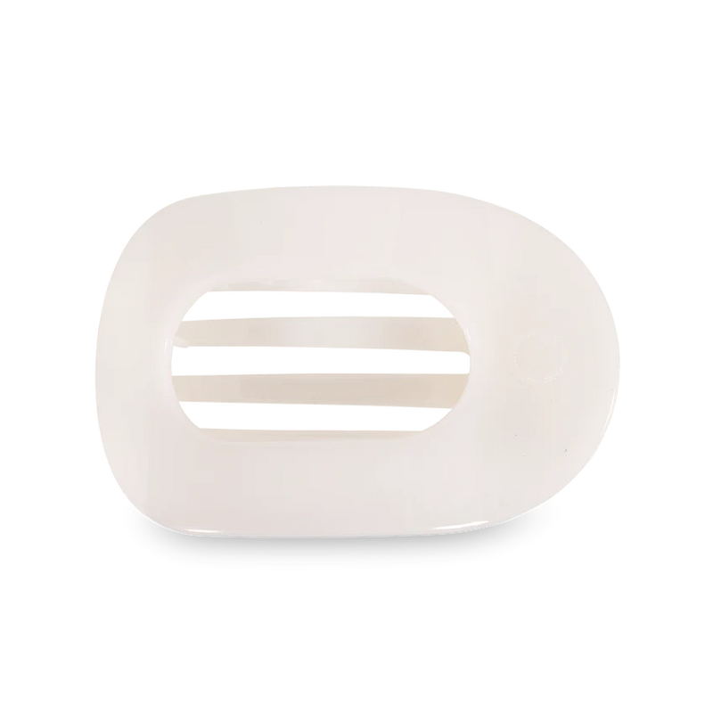 A flat round hair clip in a soft white color.