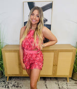 A tank and short set that includes a pair of hot pink sequin fridge shorts and sleeveless crop top to match.