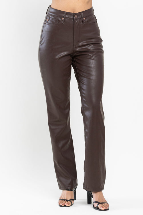 A pair of chocolate brown leather pants featuring a high waist. 