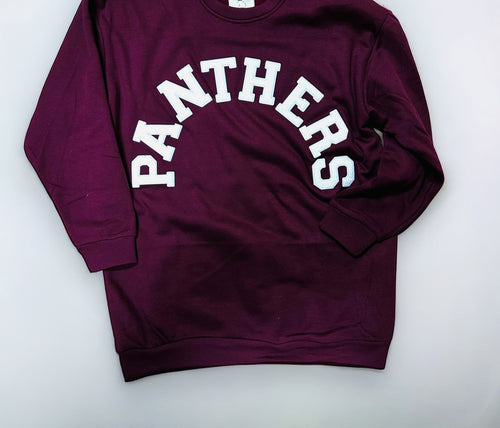 A maroon crewneck sweatshirt with "Panthers" across the front in a white curved font.