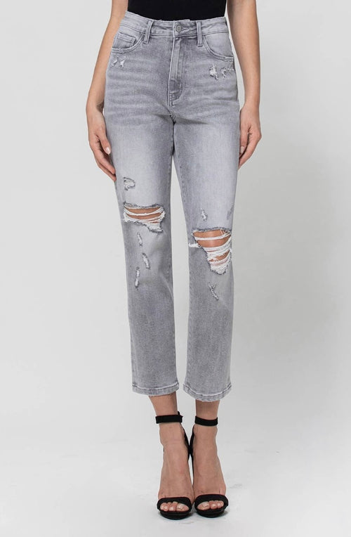 A light gray wash jean featuring a high waist, distressed holes, and a cropped fit.
